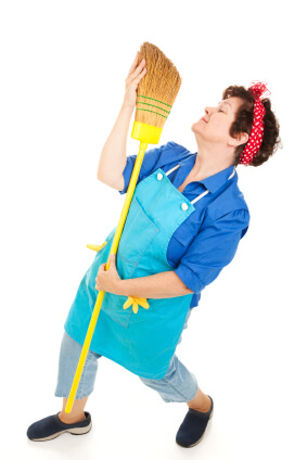 Maid dancing with broom